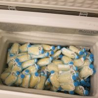 NICU RN mom with freezer full of dairy free soy free milk stored in premium bags